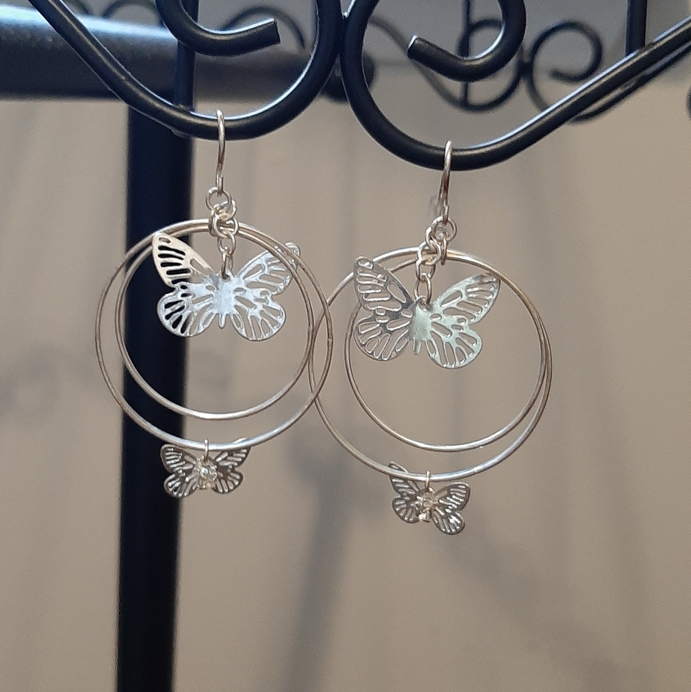 Silver butterfly/ circle earrings.